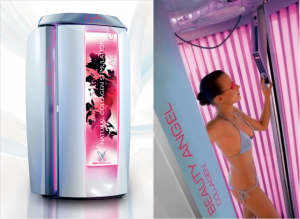Woman enjoying a rejuvenating red light therapy session in SunScape Tanning's Beauty Angel booth
